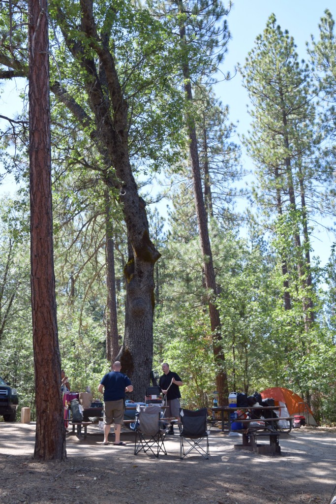 Friends hanging out at a Bass Lake campsite